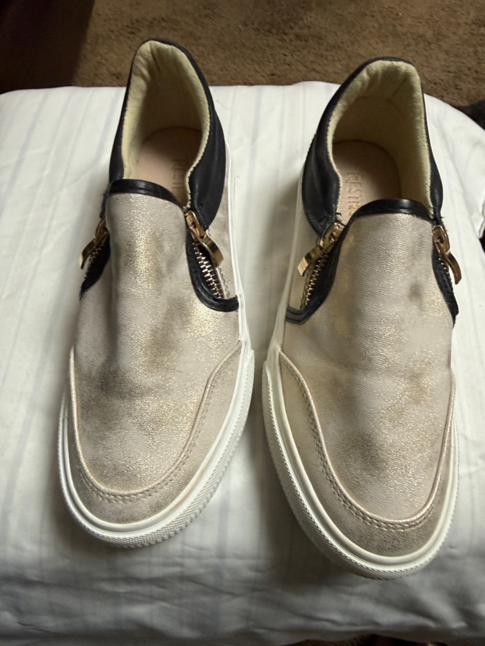 Restricted Metallic Cream Slip-On Loafers with Black Trim and Gold Zippers